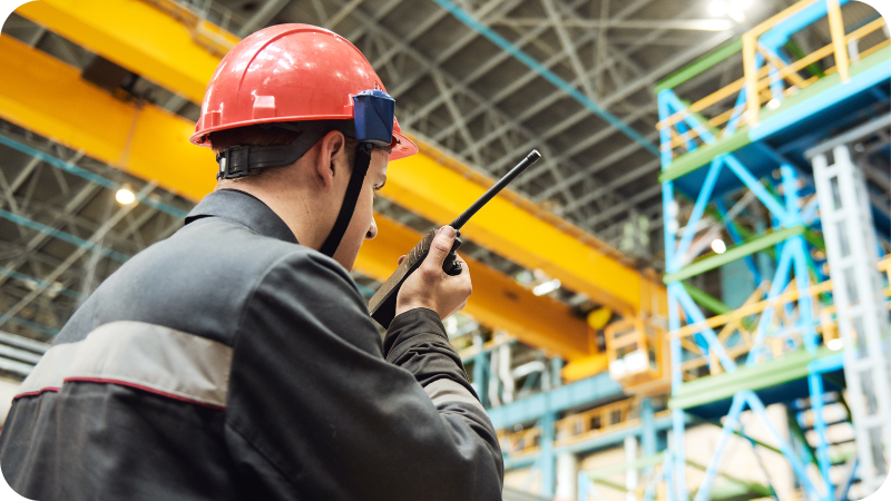 Effective-Emergency-Planning-A-Five-Step-Guide-to-Ensuring-Safety-and-Compliance-Man-Communicating-over-walkie-talkie-in-factory-IMG