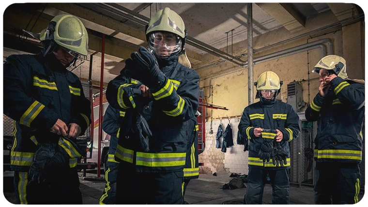 Firefighters putting on PPE